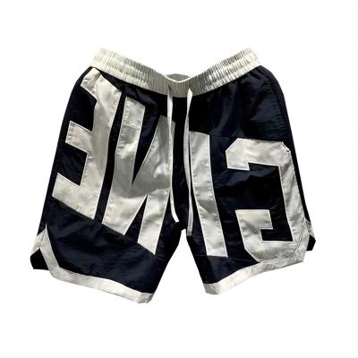 China Anti-wrinkle Letter Color Shorts Summer Men's Personality Casual Cargo Sweatpants Slim Heavy Craft Fashion Beach Shorts for sale