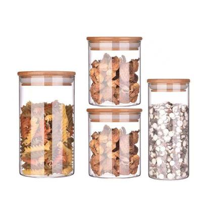 China Viable Wholesales Mini Cylindrical Empty Spice Storage Cylindrical High Quality Clear Glass Jar With Cork Bamboo Lid for sale