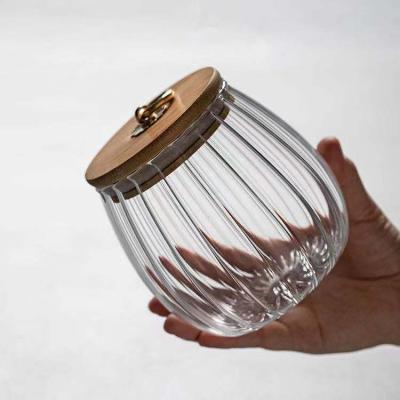 China Heatable Glass Tea Box Striped Jar Storage Jar Cover Metal Snap Nut Glass Sealed Bamboo Cookie Sealed Box for sale