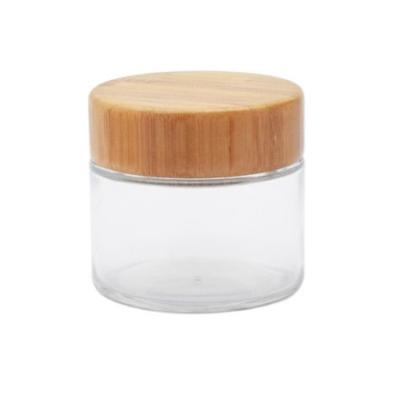 China Cosmetic Jars Round Airtight Sealed Glass Jar 4oz Clear Glass Jar With Wooden Bamboo Lid for sale