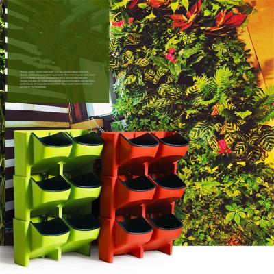 China Cheap Simply Large Wall Plastic Vertical Planter Garden Flower Pot Self Hanging Watering Flower Pot For Home Decorative for sale