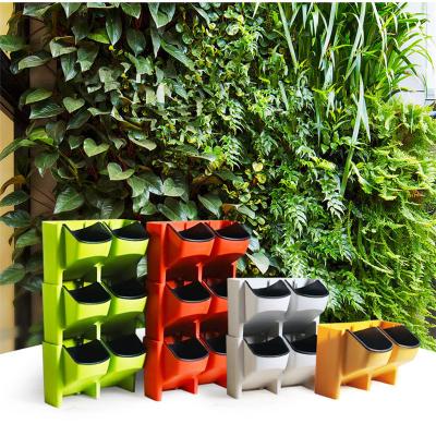 China Cheap Simply Large Wall Plastic Vertical Planter Garden Flower Pot Self Hanging Watering Flower Pot For Home Decorative for sale