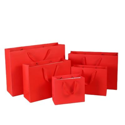 China Recyclable Wholesale Fashion Custom Boutique Clothes Packaging Coated Paper Shopping Gift Bag for sale