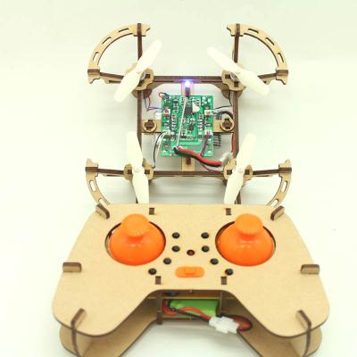 China NEW 2023 Headless Mode Self Assembly Kit FlashLight Remote Control Quadcopter RC Diy Wooden Drone Kit For Students for sale