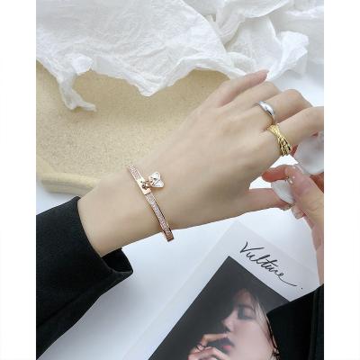 China Fashion personality niche design stainless steel bangle bracelets lock environmental friendly female shape inlaid zircon bracelet jewelry accessories for sale