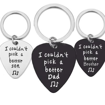 China Romantic Hot Selling Inscription Guitar Picks Father's Day Black Titanium Steel Gift Customized Samples Plated Metal Key Chains Keychains for sale