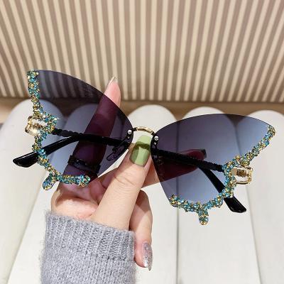 China New arrival fashion sunglasses women's border shape sunglasses, personalized and exaggerated rimless sunglasses for sale