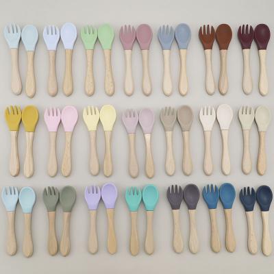 China BPA Free Color New Baby Wood Handle Fork Spoon Match Set Baby Training Tableware Food Safe Baby Beech Fork Spoon for sale