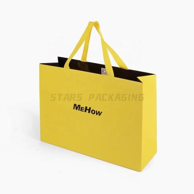 China Recycled Materials Custom Branded Logo 210GSM C1S Coated Fancy Gift Bag Packaging Paper Shopping Bag for sale