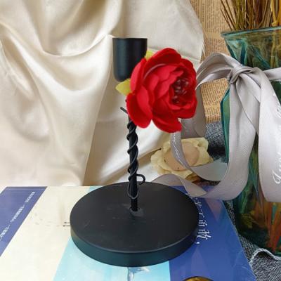 China Morden Handcraft Luxury Vintage Metal Craft Candlestick Stand Black Irregular Shaped Candlestick With Flower for sale