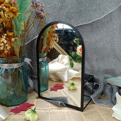 China Nordic magnifying type desktop type black arch style metal arch table cosmetic mirror for sale