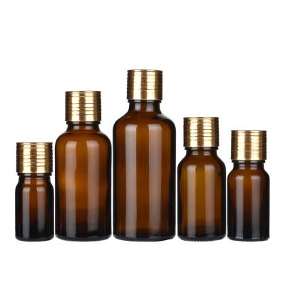 China Personal Care 5ml 10ml 15ml 20ml 30ml 50ml 100ml Essential Oil Amber Glass Bottle With Orifice Reducers for sale