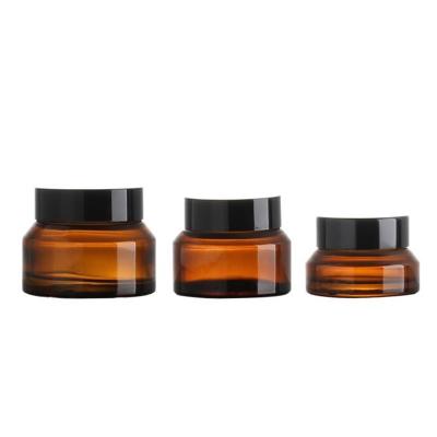 China Personal Care 15g 30g 50g Empty Cosmetic Jars Container Amber Glass Cream Shoulder Glass Cosmetic Jar For Reusing Cosmetic Jars Black Lids for sale