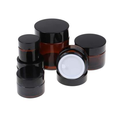 China Personal Care 5g 10g 15g 20g 30g 50g 100g Empty Refillable Round Amber Glass Cosmetic Jar Vials Travel Container Cream Makeup Containers for sale