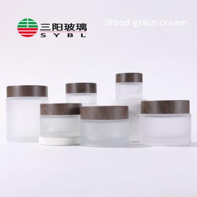 China Personal Care Cosmetic Jar Cream Bottle Container Lids For Face Cream Lotion Balm Bottle 10g 15g 30g 50g 100g Frosted Glass With Dark Wooden for sale