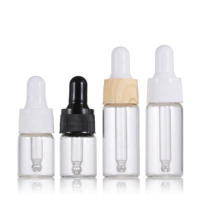 China Personal Care 1ml 2ml 3ml Clear Round Dropper Bottles Amber Glass Bottle With Dropper For Cosmetic Jars With Dropper for sale