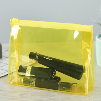 China 100% PVC Cosmetic Bag EVA Travel Plastic Transparent Eco-friendly PVC Yellow Toiletry Bag Make Up Cosmetic Pouch for sale