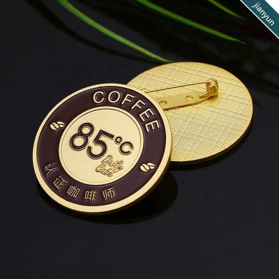 China 3D Embossed Design Logo Round Shape Metal Badge With Needle for sale