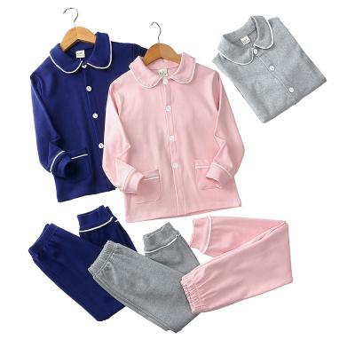 China New arrival spring autumn unisex plus size pajamas set cotton long sleeve solid sleepwear 2pcs suit for kids for sale