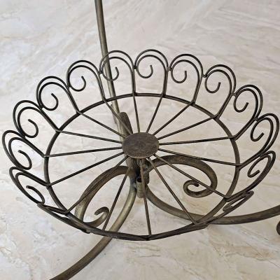 China Idyllic Indoor Creative Pot Rack Flower Iron Display Plant Stand Floor Multilayer Plant Shelf for sale