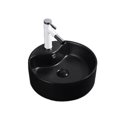 China Small Modern Round Ceramic Hotel Bathroom Ceramic Vanities Sink Art Counter Basin for sale