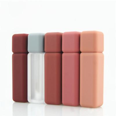 China Hot Selling Cosmetic Container Lip Gloss Container Brand Cosmetic Hot Custom Cylinder Empty Lip Gloss Plastic Tubes With Cap for sale