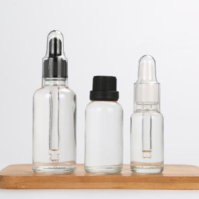 China Transparent black and white personal care drop tube bottles, glass cosmetics, bottled bottles of essential oil liquid essence bottle. for sale