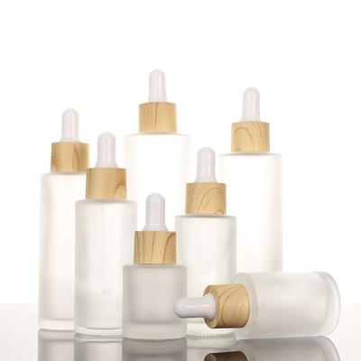 China Grain Cover Cosmetic Wood Oil Bottle Frosted Glass Essence Emulsion Bottle Small Empty Cosmetics Bottle Portable Bottling for sale