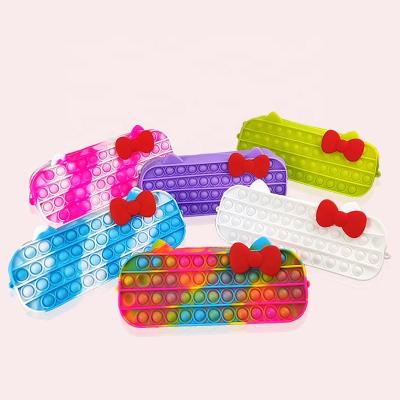 China Gift Cute bow knot waterproof light soft silicone customs color funny pop pencil box pencil case stationery gift for kids for sale