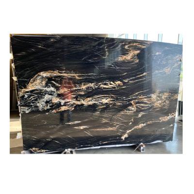 China Modern Luxury Black Brazil Magma Gold Granite Slab Price For Kitchen Countertops Worktops for sale