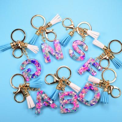 China Daily Life New Arrival Cute A-Z Alphabet Rainbow Acrylic Key Chains Tassel Pink Gold Plated Plastic Key Chain for sale