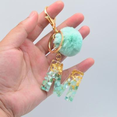 China A-Z 26 Letters Acrylic Key Chain Popular Plastic Gold Tassel Ring Green Shell Bag Pendant Daily Life for sale