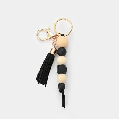 China Gold Colorful Wooden Key Ring Women Hanging Tassel Beaded Popular Combination Key Chain Daily Life Silicone for sale