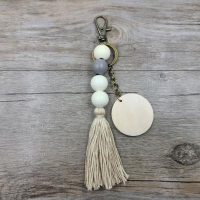 China Boho White Daily Life Handmade Cotton Multicolor Tassel Custom Disc Beaded Key Chain Wooden Beaded Key Chain for sale