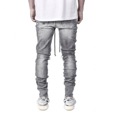 China New Viable Streetwear Hip Hop Men's Ripped Patch Stretch Skinny Jeans Pants Distressed Destroyed Tapered Jogger Denim Male Casual Pants for sale