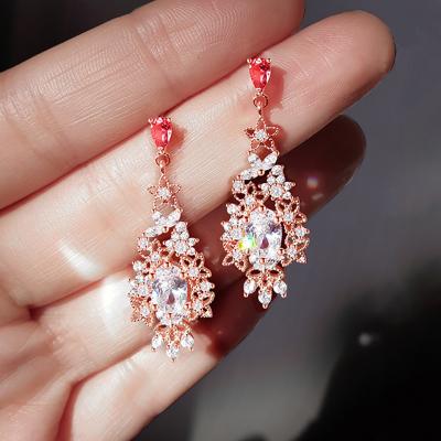 China 925 Sterling Silver Trendy Crystal Hollow Outlet Flower Zircon Dangle Dangle Earrings Wedding Soft Gold Earings Fashion Jewelry for sale