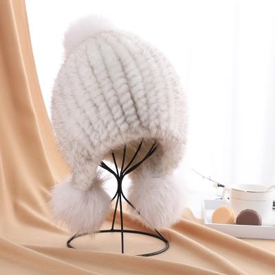 China Winter Fashion JOINT Earflap Pom Ball Women Knitted Mink Fur Hats for sale