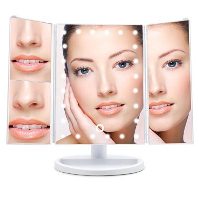 China Desk Lighted Vanity Light Up Led Cosmetic Mirror Triple Lighted Folding LED Magnified Makeup Mirror With Lights for sale