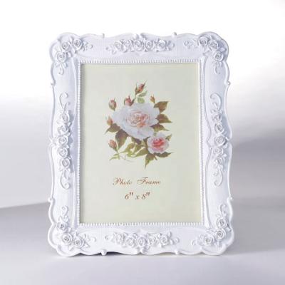 China Beautiful Environmentally Friendly Craft Resin White Resin Photo Frame ABS Photo Frame for sale