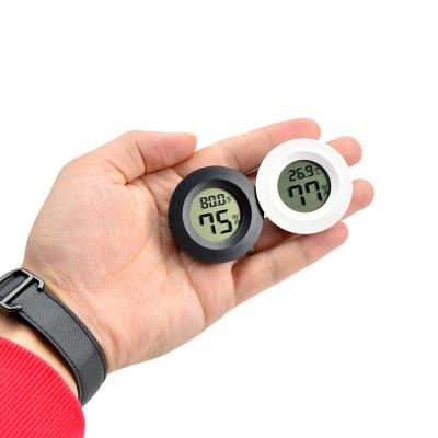 China Quick Response Round Mini Electronic Digital Temperature Humidity Meter F/C Switch Key & ON/OFF Key for sale