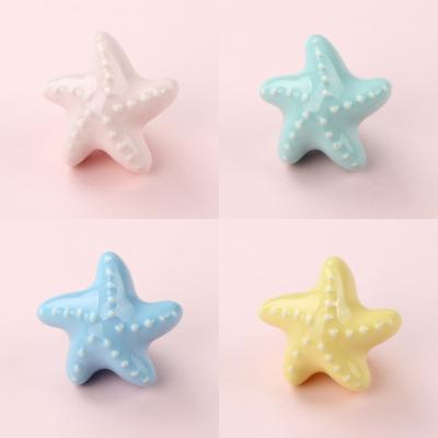 China Home Furniture Buffet Wardrobe Door Handle Star Kids Single Hole Wall Hook Contemporary Colorful Ceramic Small Drawer Handle for sale