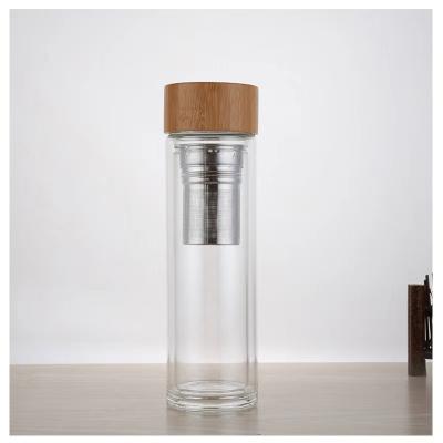 China Minimalist portable bamboo lid glass water bottle sports wholesale eco friendly drinks bottle with custom logo for sale for sale