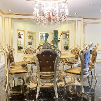 China (Other)Adjustable Italian Classic Dining Room Furniture Hand Carving Wooden Structure Marble Gold Leaf Top Dining Table for sale