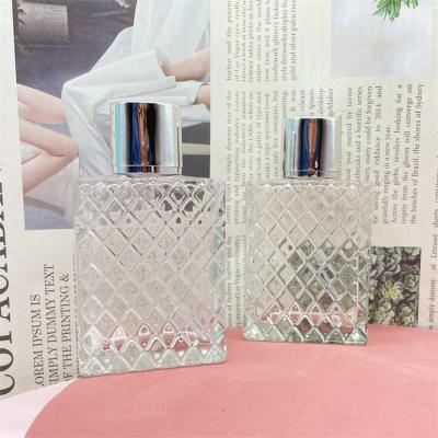 China Wholesale Cosmetic Square Glass 100ml Perfume Bottle With Sliver Lids for sale