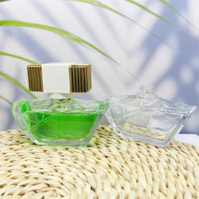 China 60ml Perfume Glass Cosmetic Transparent Bottles With Glossy Square Plastic Lid for sale