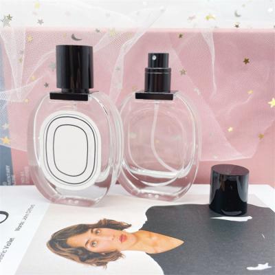 China 30ml Cosmetic Clear Oval Shape Spray Refillable Glass Perfume Bottle With Customized Stickers for sale