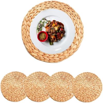 China Kitchen factory wholesale manual round woven plastic rattan table mat customized rattan placemats for sale