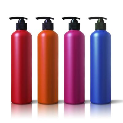 China Cosmetic PE Bottle 450ml Plastic Cylinder Shaped Plastic Bottles For Shampoo Red PE Shower Bottle With Press Pump Head for sale