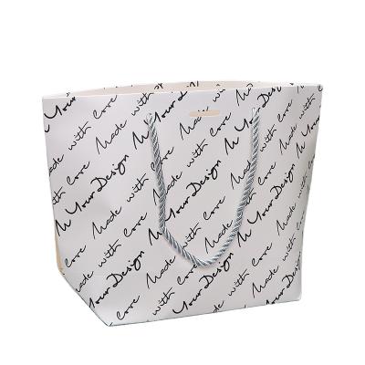 China Recycled Materials Wholesale Fashion Boutique Custom Clothes Gift Tote Shopping Bag for sale