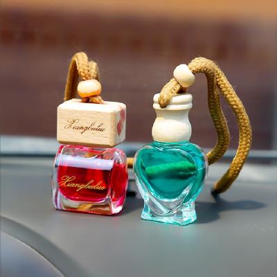 China 5ml 7ml 10ml Mini Luxury Car Perfume Bottle With Wooden Cap Aromatherapy Bottle for sale